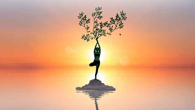 woman doing yoga with tea branch